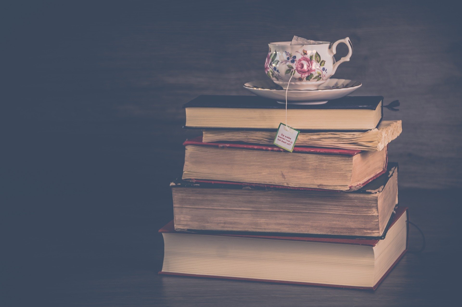 stack of books and a teacup atop them